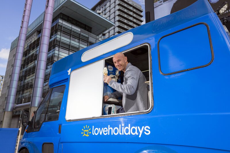 Loveholidays and Salford City Football Club celebrate sponsorship by handing out free holidays